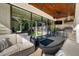 Covered outdoor kitchen with grill and dining area overlooking yard offers seamless indoor-outdoor living at 13 Hill Ave, Orlando, FL 32801
