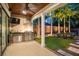 Covered outdoor kitchen and patio area with grill and outdoor seating at 13 Hill Ave, Orlando, FL 32801