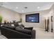 Home theater room with large screen, surround sound, comfortable seating, and modern design at 13 Hill Ave, Orlando, FL 32801