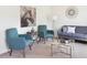 Virtually staged living room featuring modern decor, neutral colors, and ample seating arrangements at 1391 Dalkeith Cv, Sanford, FL 32771