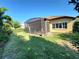 Lush backyard featuring a covered patio perfect for outdoor entertaining and relaxation at 15707 Cutter Sail Pl, Winter Garden, FL 34787