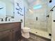 Modern bathroom with glass-enclosed shower, stylish vanity, and contemporary fixtures at 15707 Cutter Sail Pl, Winter Garden, FL 34787