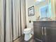 Cozy bathroom with shower curtain and decorative elements at 15707 Cutter Sail Pl, Winter Garden, FL 34787