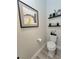 Stylish powder room with modern artwork and decor at 15707 Cutter Sail Pl, Winter Garden, FL 34787