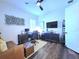 Modern bedroom featuring desk, couch, and contemporary decor at 15707 Cutter Sail Pl, Winter Garden, FL 34787