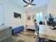 Bright bedroom featuring a work desk with blue ottoman at 15707 Cutter Sail Pl, Winter Garden, FL 34787
