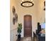 Elegant entryway with hardwood floors, modern lighting, and stylish decor at 15707 Cutter Sail Pl, Winter Garden, FL 34787