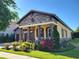 Charming single-story home featuring a stone facade, lovely landscaping, and a two-car garage at 15707 Cutter Sail Pl, Winter Garden, FL 34787