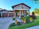Charming home with stone accents, a brick walkway, and lush landscaping at 15707 Cutter Sail Pl, Winter Garden, FL 34787