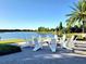 Picturesque outdoor seating area featuring a firepit with views of the lake at 15707 Cutter Sail Pl, Winter Garden, FL 34787