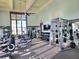 Bright fitness center with modern equipment, including weights, treadmills, and a large mirror wall at 15707 Cutter Sail Pl, Winter Garden, FL 34787