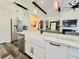 Modern kitchen featuring a white farmhouse sink and stainless steel appliances at 15707 Cutter Sail Pl, Winter Garden, FL 34787