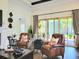 Spacious living room with large windows, fireplace, and comfortable seating at 15707 Cutter Sail Pl, Winter Garden, FL 34787
