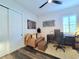 Charming home office with a modern desk, comfortable seating, and stylish décor at 15707 Cutter Sail Pl, Winter Garden, FL 34787