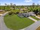 Aerial shot of a single Gathering home boasting a large yard in a wooded area at 15823 Sw 27Th Avenue Rd, Ocala, FL 34473
