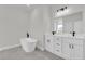 Luxurious bathroom boasts a soaking tub and double vanity with modern fixtures at 15823 Sw 27Th Avenue Rd, Ocala, FL 34473