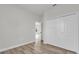 Spacious room with wood-look floors, closet, and easy access to other parts of the home at 15823 Sw 27Th Avenue Rd, Ocala, FL 34473