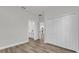 This bedroom boasts wood-look floors, a closet, and access to the bathroom and kitchen at 15823 Sw 27Th Avenue Rd, Ocala, FL 34473