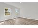 Bright bedroom features two windows and light-colored flooring at 15823 Sw 27Th Avenue Rd, Ocala, FL 34473