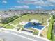 Aerial view of community playground with ample green space, walking paths, and nearby residential homes at 16238 Misty Hills Ave, Winter Garden, FL 34787
