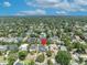 Expansive aerial view of a neighborhood showcasing lush landscaping and well-maintained homes at 1661 Woodland Ave, Winter Park, FL 32789