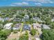 Stunning aerial view showcasing the property's landscaped yard in a lush neighborhood at 1661 Woodland Ave, Winter Park, FL 32789