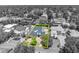 An aerial outline shows a luxury home with mature trees, professional landscaping and a circular driveway at 1661 Woodland Ave, Winter Park, FL 32789