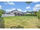 Large, well-maintained backyard with a manicured lawn and privacy fence at 1661 Woodland Ave, Winter Park, FL 32789