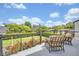 Enjoy a relaxing view from this balcony with comfortable seating and a beautiful view at 1661 Woodland Ave, Winter Park, FL 32789