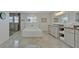 Luxurious bathroom featuring a soaking tub, shower, and double vanity at 1661 Woodland Ave, Winter Park, FL 32789