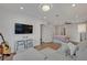 Bright and airy bedroom with a comfortable seating area and a guitar at 1661 Woodland Ave, Winter Park, FL 32789