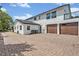 Spacious exterior with brick driveway and a two car garage at 1661 Woodland Ave, Winter Park, FL 32789