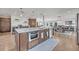 Gourmet kitchen island with stainless steel appliances and granite countertops at 1661 Woodland Ave, Winter Park, FL 32789