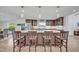 Well-appointed kitchen with a large island, pendant lights, stylish cabinetry, and stainless-steel appliances at 1661 Woodland Ave, Winter Park, FL 32789