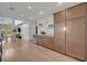 Stylish kitchenette and dining area including a large refrigerator and serving area with cabinets and wall decor at 1661 Woodland Ave, Winter Park, FL 32789