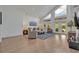Bright living room boasts high ceilings, modern decor, and French doors leading to the backyard at 1661 Woodland Ave, Winter Park, FL 32789