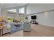 Cozy living room with high ceilings, natural light, and comfortable seating near the backyard at 1661 Woodland Ave, Winter Park, FL 32789