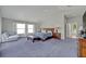 Spacious main bedroom with vaulted ceilings and ample natural light from the windows at 1661 Woodland Ave, Winter Park, FL 32789