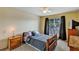 Bedroom with lots of natural light, a ceiling fan, and carpeted floors at 1728 Townhall Ln # 1728, Orlando, FL 32807