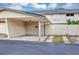 Carport featuring ample parking and view of the home's charming exterior at 1728 Townhall Ln # 1728, Orlando, FL 32807