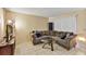 Cozy living room featuring a comfortable sectional sofa and modern decor at 1728 Townhall Ln # 1728, Orlando, FL 32807