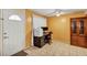 Bright home office space with a desk, printer, and tiled floor at 1728 Townhall Ln # 1728, Orlando, FL 32807