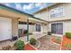 Spacious patio area featuring tiled flooring, a garden, and a view of the residence at 1728 Townhall Ln # 1728, Orlando, FL 32807