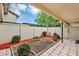 Private patio with rock garden and white picket fence; peaceful outdoor retreat at 1728 Townhall Ln # 1728, Orlando, FL 32807