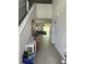 Inviting entryway with a staircase and tiled floors leading to an open living area and view of the backyard at 17333 Cagan Crossings Blvd, Clermont, FL 34714