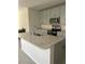 Well-lit kitchen featuring granite countertops, stainless steel appliances, and a kitchen island with a sink at 17333 Cagan Crossings Blvd, Clermont, FL 34714