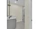 Bathroom featuring a double sink vanity, large mirror, and glass enclosed shower at 1819 Carr St, Deland, FL 32720