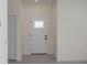 Bright foyer featuring a decorative front door with glass detail, leading to a welcoming interior at 1819 Carr St, Deland, FL 32720
