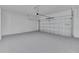 Spacious garage featuring an epoxy floor, with a clean and well-lit interior at 1819 Carr St, Deland, FL 32720