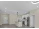 Spacious kitchen with island, stainless steel appliances, and neutral paint at 1819 Carr St, Deland, FL 32720